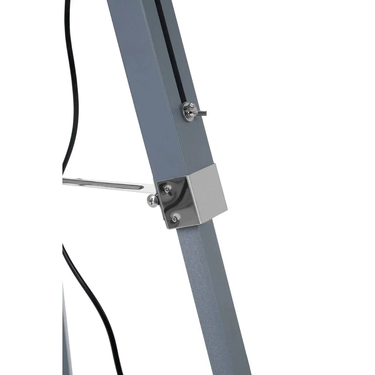 Close-up of grey metal lamp stand with chrome fixture and black cord detail