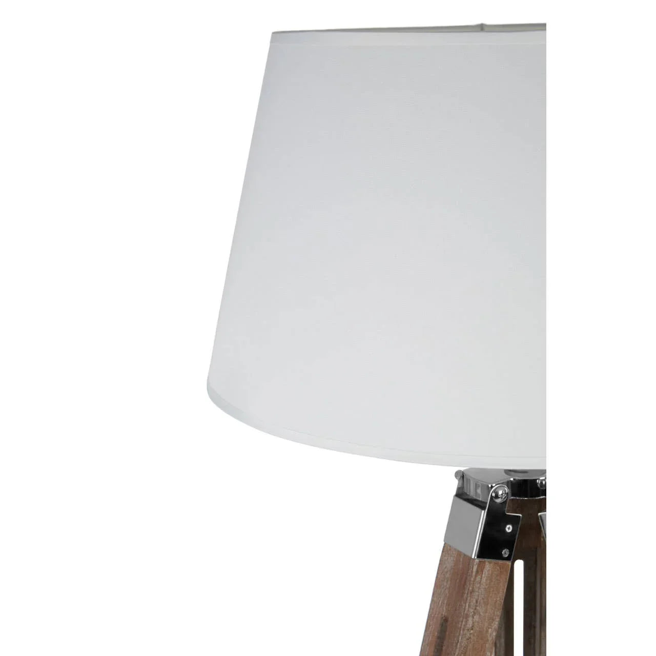 Tripod floor lamp with white fabric shade and wooden legs, side close-up view
