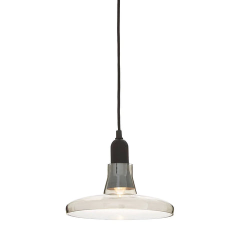 Clear glass pendant light with black fitting and exposed bulb on white background