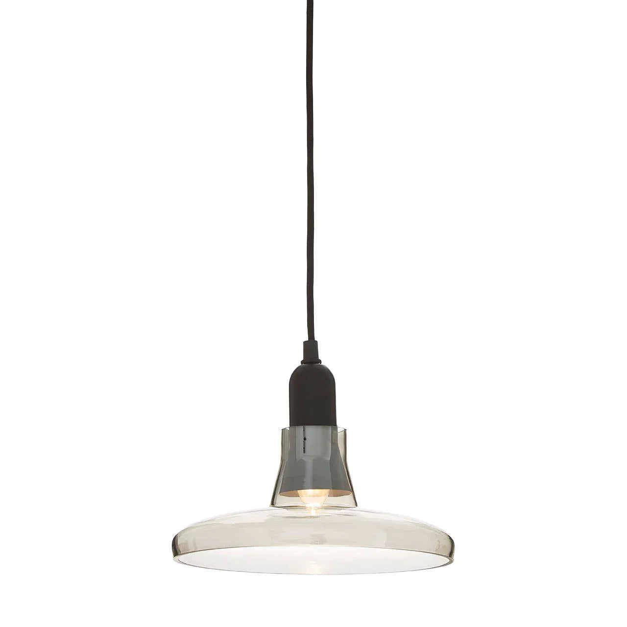 Clear glass pendant light with black fitting and exposed bulb on white background