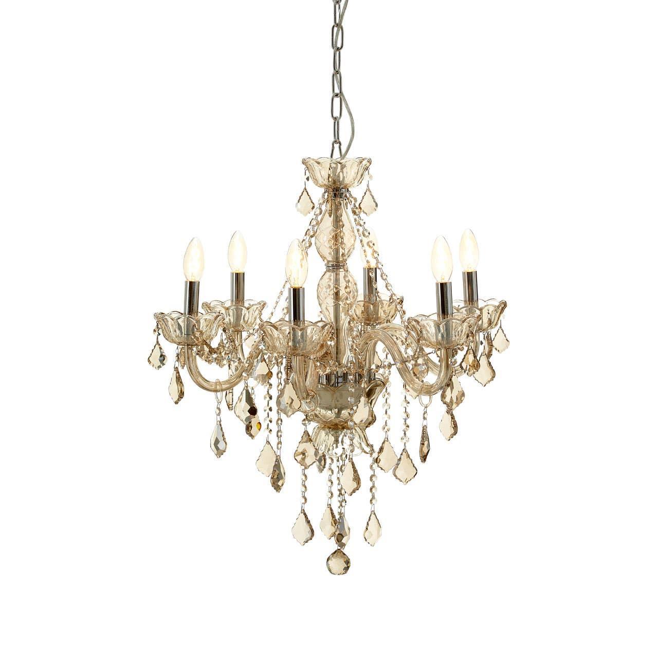 Crystal chandelier with six candle lights and gold droplets on hanging chain