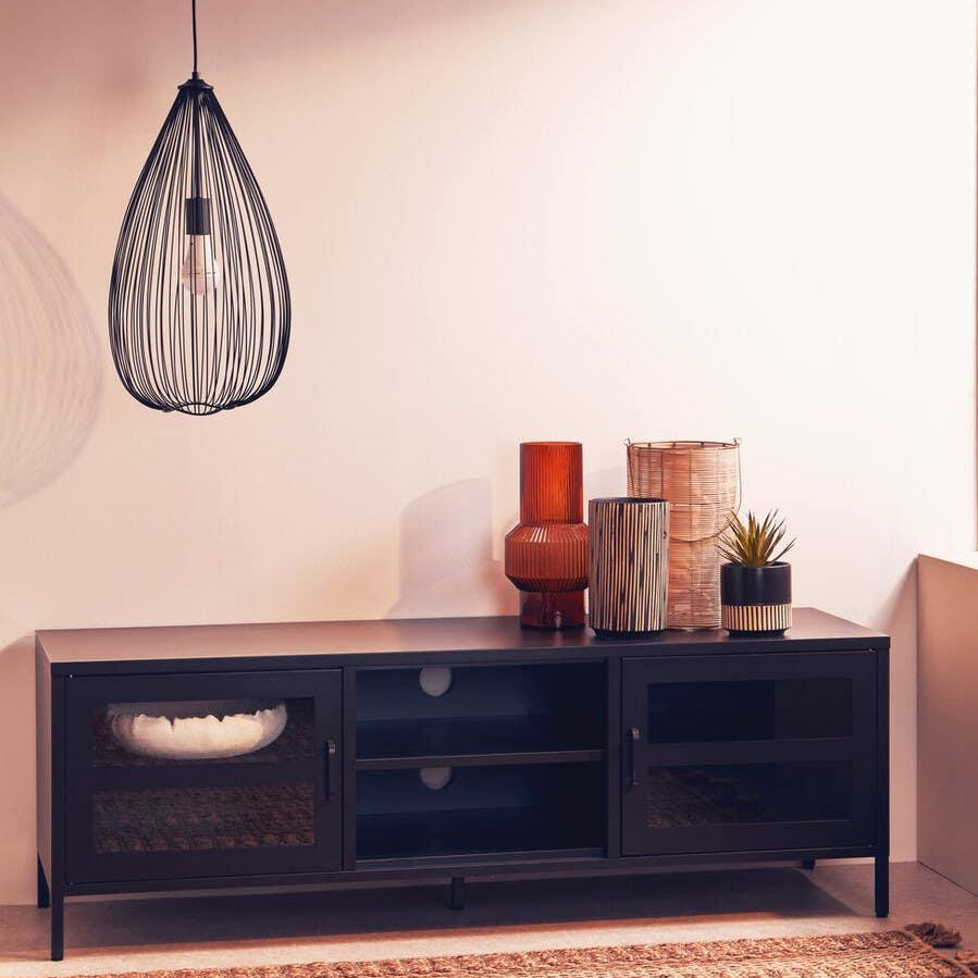 Black TV unit with glass doors, decorative vases, and pendant light on woven rug