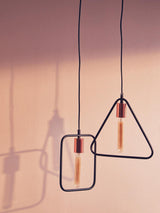 Modern pendant light with rectangular and triangular black frames and exposed bulbs