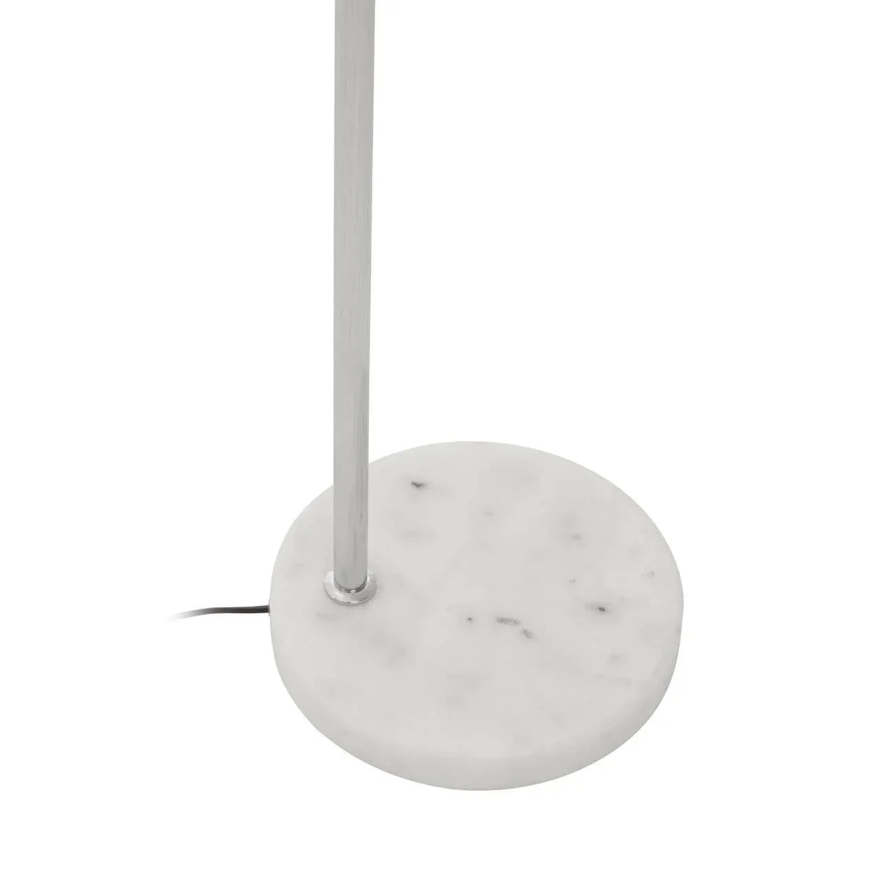 Floor lamp with round white marble base and slim metal pole, close-up view