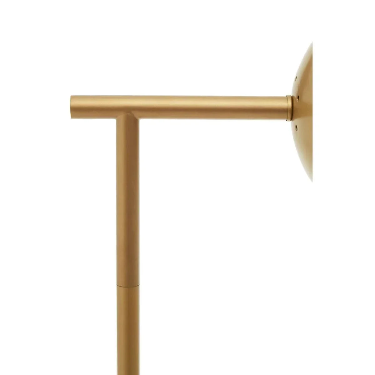 Brass floor lamp stem and base closeup with matte gold finish