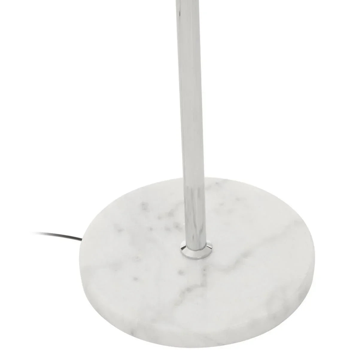 Round white marble lamp base with chrome pole and visible black power cord