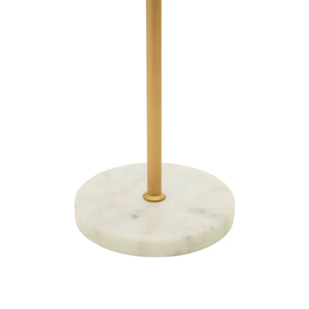 Gold floor lamp with round white marble base close-up