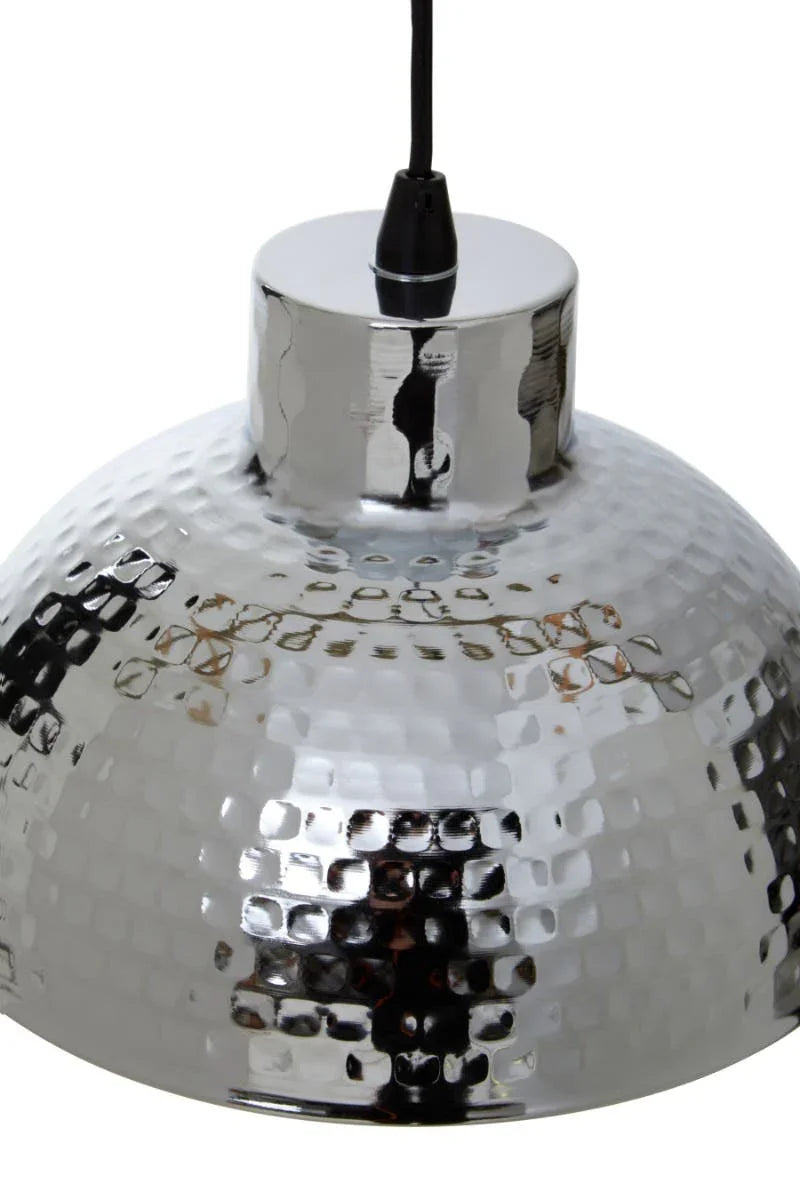 Chrome hammered metal pendant light with black cord, close-up of textured shade