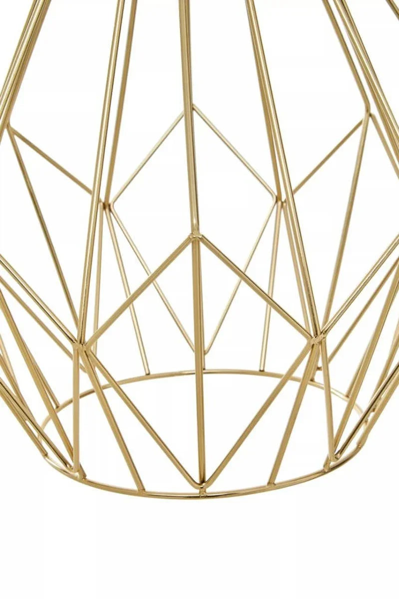 Gold geometric metal table base with openwork wire design, close-up view