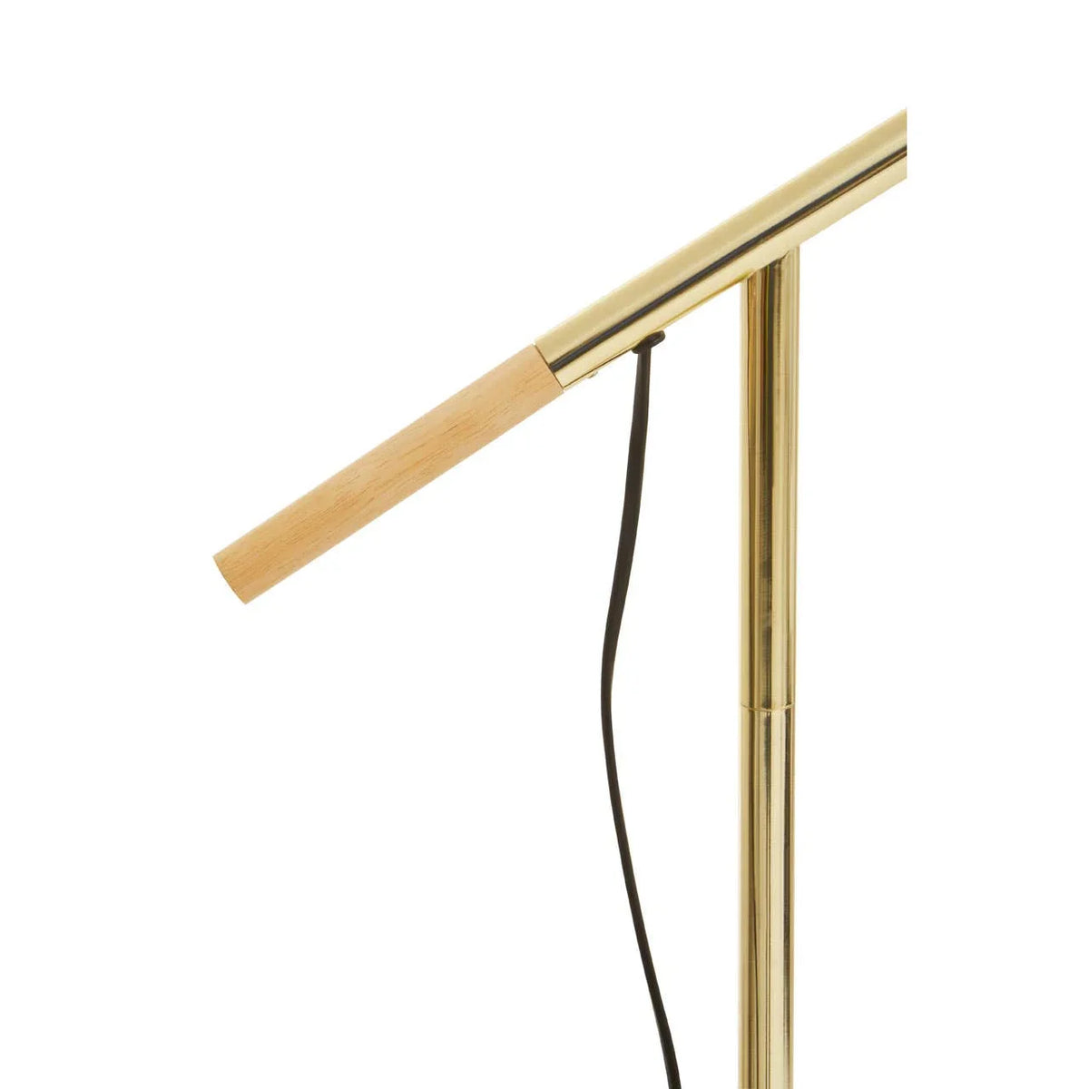 Brass and wood floor lamp with slim angled arm and visible black power cord