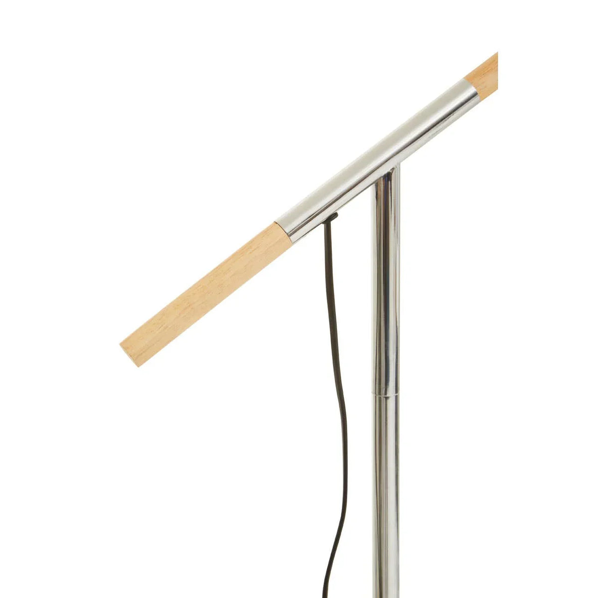 Contemporary floor lamp with chrome stand and wooden arm, close-up side view