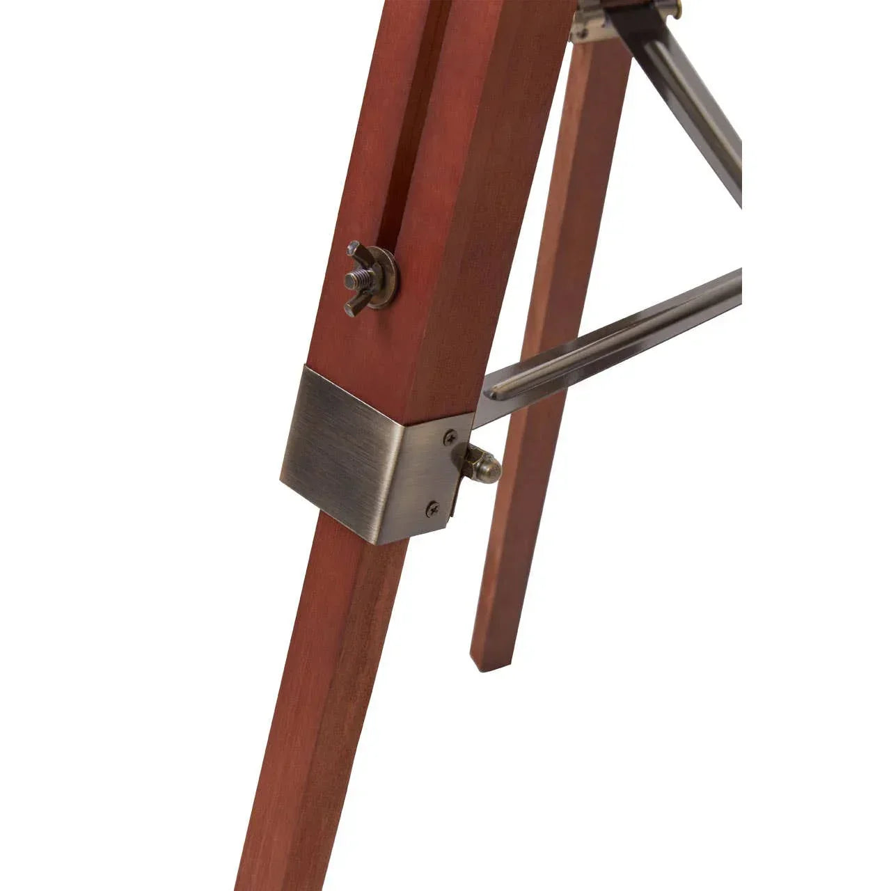 Closeup of wooden furniture leg with brushed metal bracket and support bar