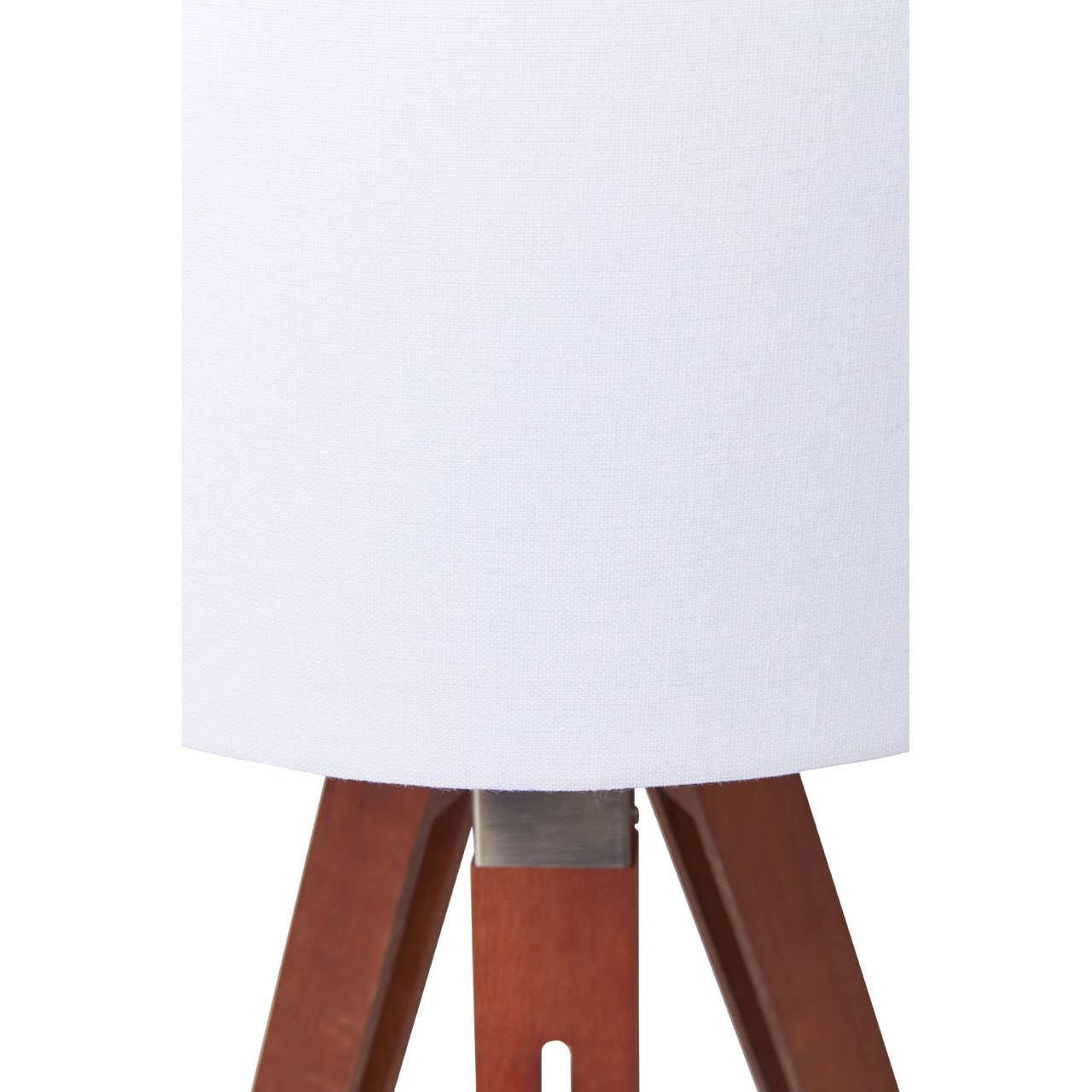 White fabric lampshade with wooden tripod lamp base close-up