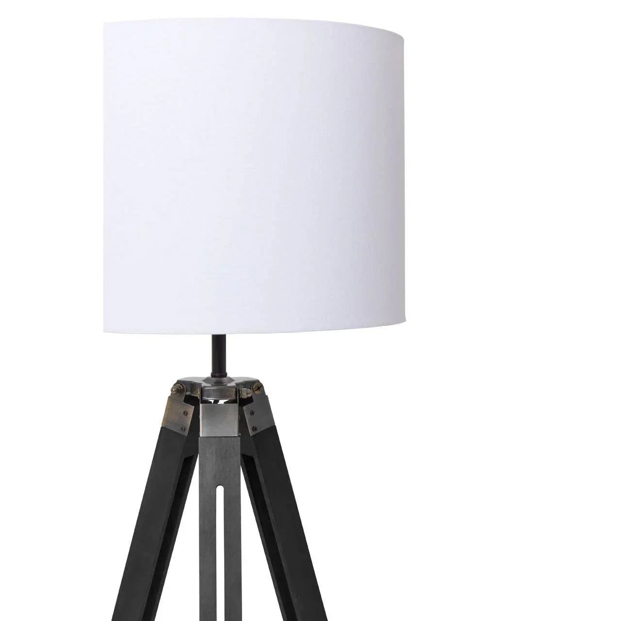 tripod table lamp with black wooden legs and white fabric drum shade