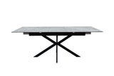 A modern rectangular dining table with a gray stone-look top and a black metal X-frame base, shown against a plain white background.