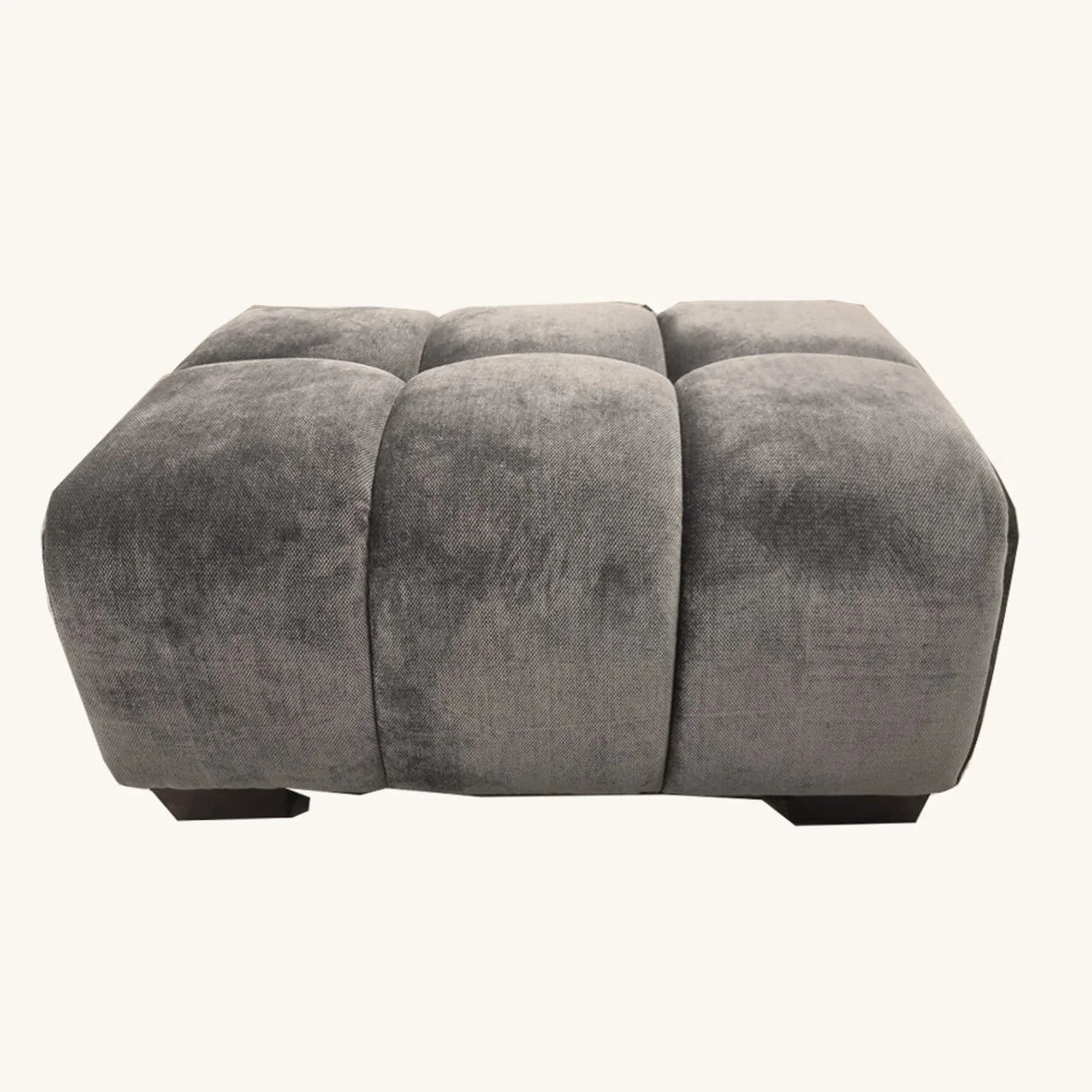 Grey velvet ottoman with tufted cushion and block feet, front view