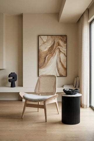 Grey fabric chair with a cane backrest, featuring a curved seat and light washed elm wood legs.