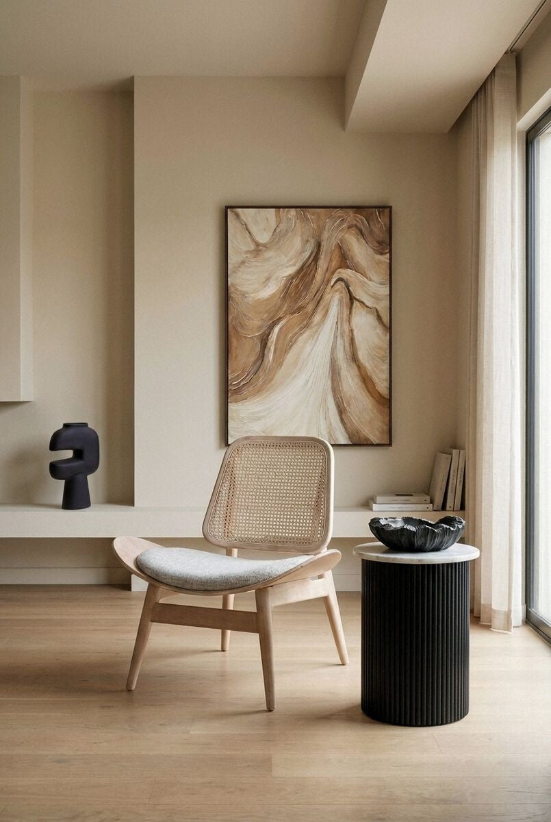 Grey fabric chair with a cane backrest, featuring a curved seat and light washed elm wood legs.