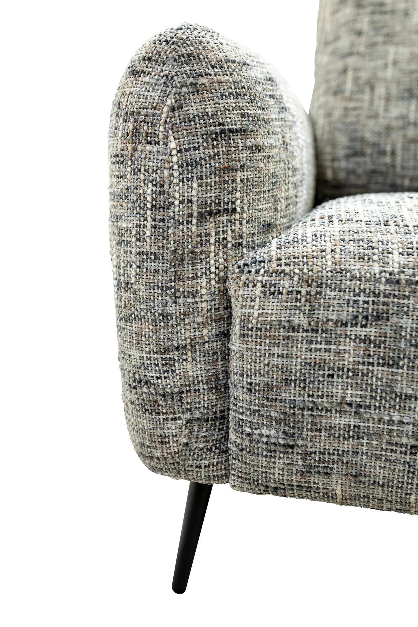 Close-up of a textured woven upholstered armrest and seat cushion in a gray and off-white bouclé fabric, with a black tapered leg visible against a white background.