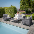 Grey outdoor sofa set with rope detailing beside a pool, woman seated on cushioned seat