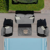 Grey outdoor sofa set with armchairs and coffee table on decking beside pool