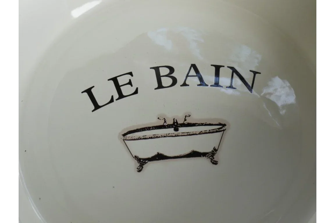 Cream ceramic bowl with LE BAIN text and vintage bathtub illustration