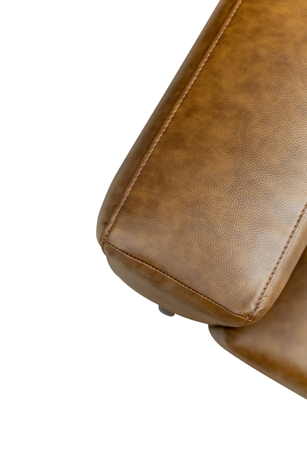 Close-up of a brown faux leather armrest or chair cushion showing the textured grain and stitching, isolated on a white background.