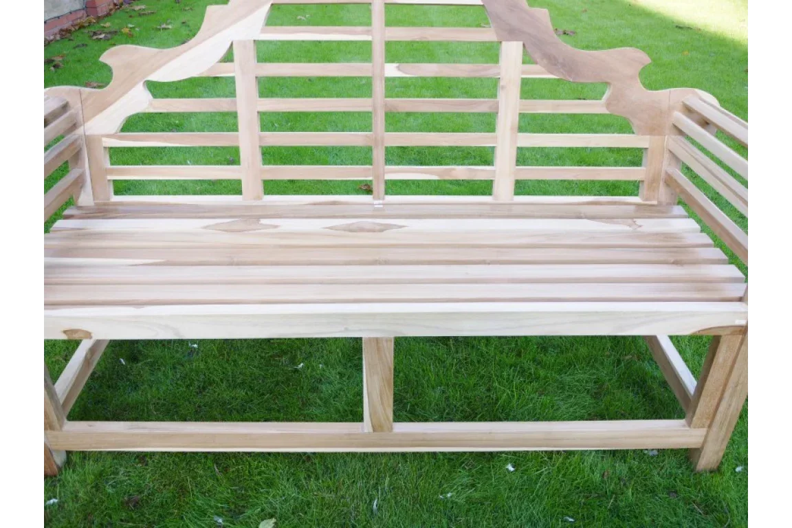 Natural wood garden bench with slatted backrest and seat on grass