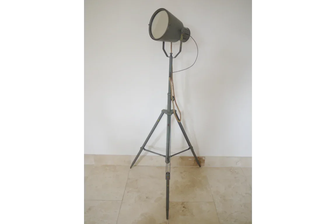 Grey industrial floor lamp with tripod metal base and round shade