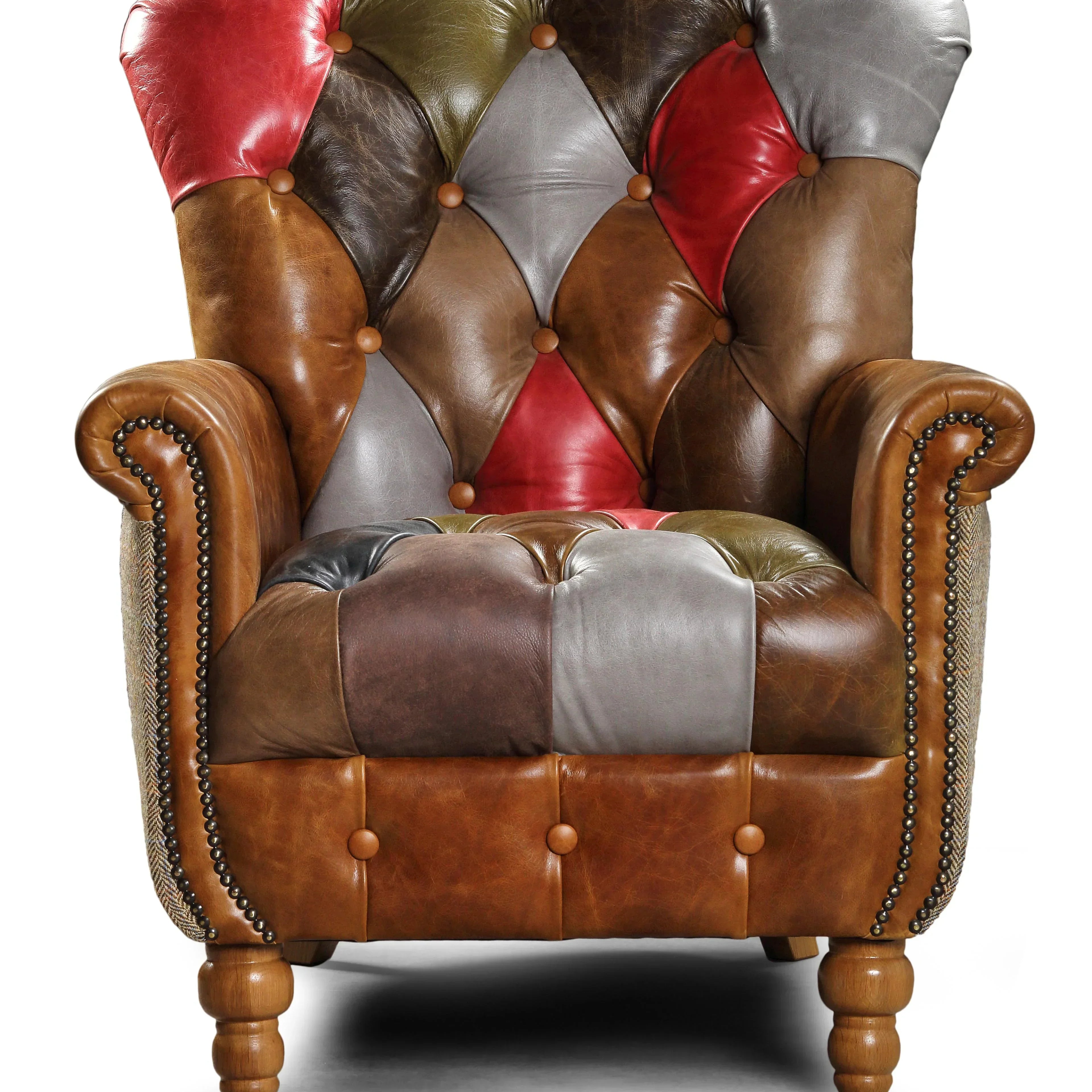 Patchwork leather armchair with studded arms and turned wooden legs, front view