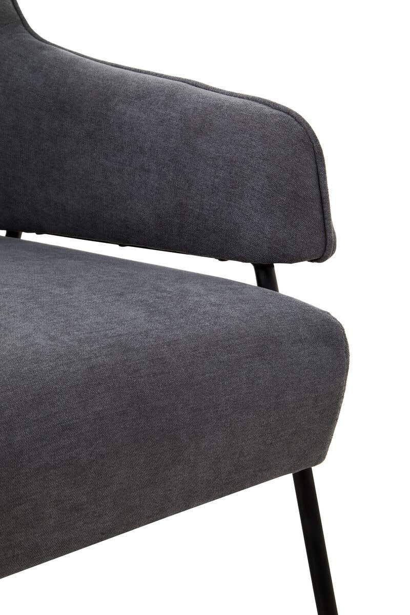 Close-up of dark grey fabric armchair seat and backrest with slim black legs