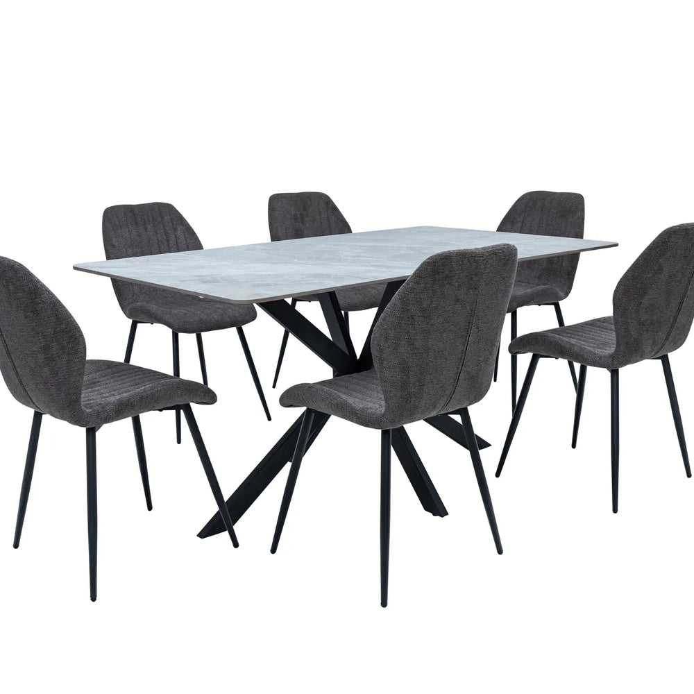 A 7-piece dining set featuring a rectangular light gray stone-look table with a black metal X-base, surrounded by six gray upholstered chairs with black legs, shown on a plain white background.