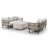 Modern outdoor sofa set with beige cushions and rectangular stone coffee table