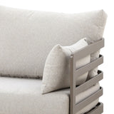 Beige fabric sofa corner with metal armrest and matching scatter cushion