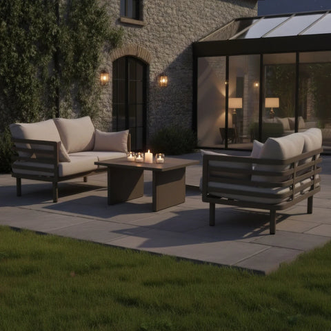 Beige outdoor sofa set with matching coffee table and candles on patio
