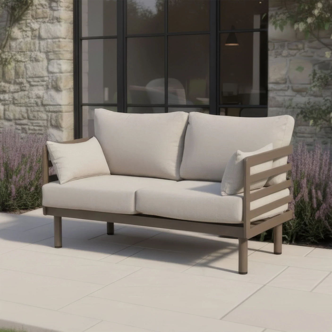 Outdoor garden sofa with beige cushions and wooden frame on patio