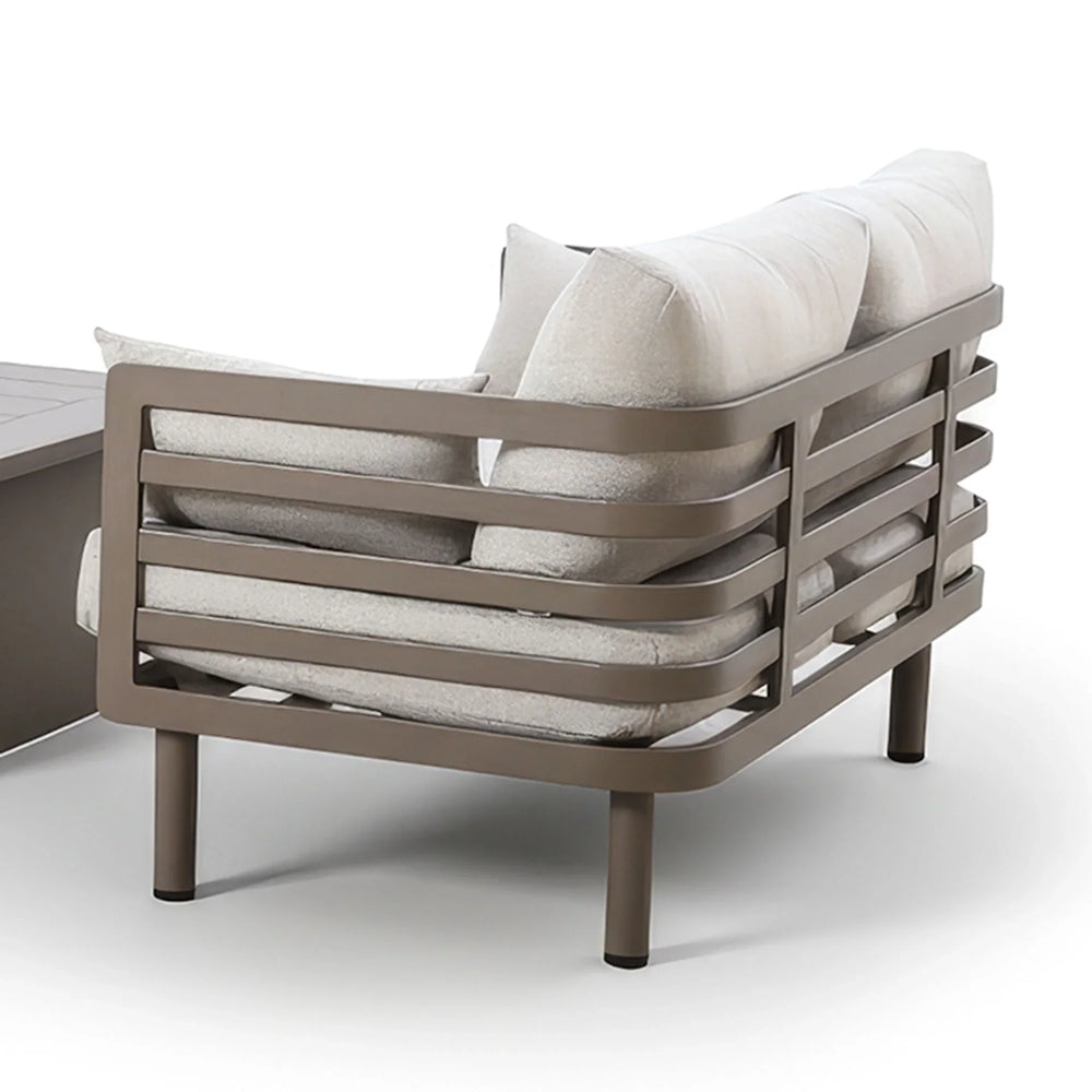 Outdoor sofa with taupe metal frame and light grey cushions, angled rear view