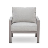 Grey fabric armchair with metal frame and thick seat and back cushions, front view