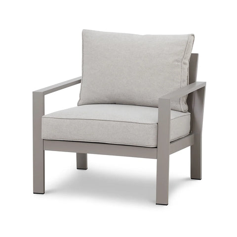 Modern armchair with grey metal frame and light grey cushions, angled front view
