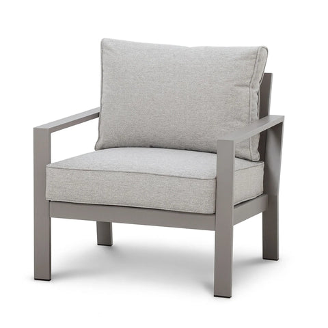 grey armchair with metal frame and thick padded cushions, angled front view