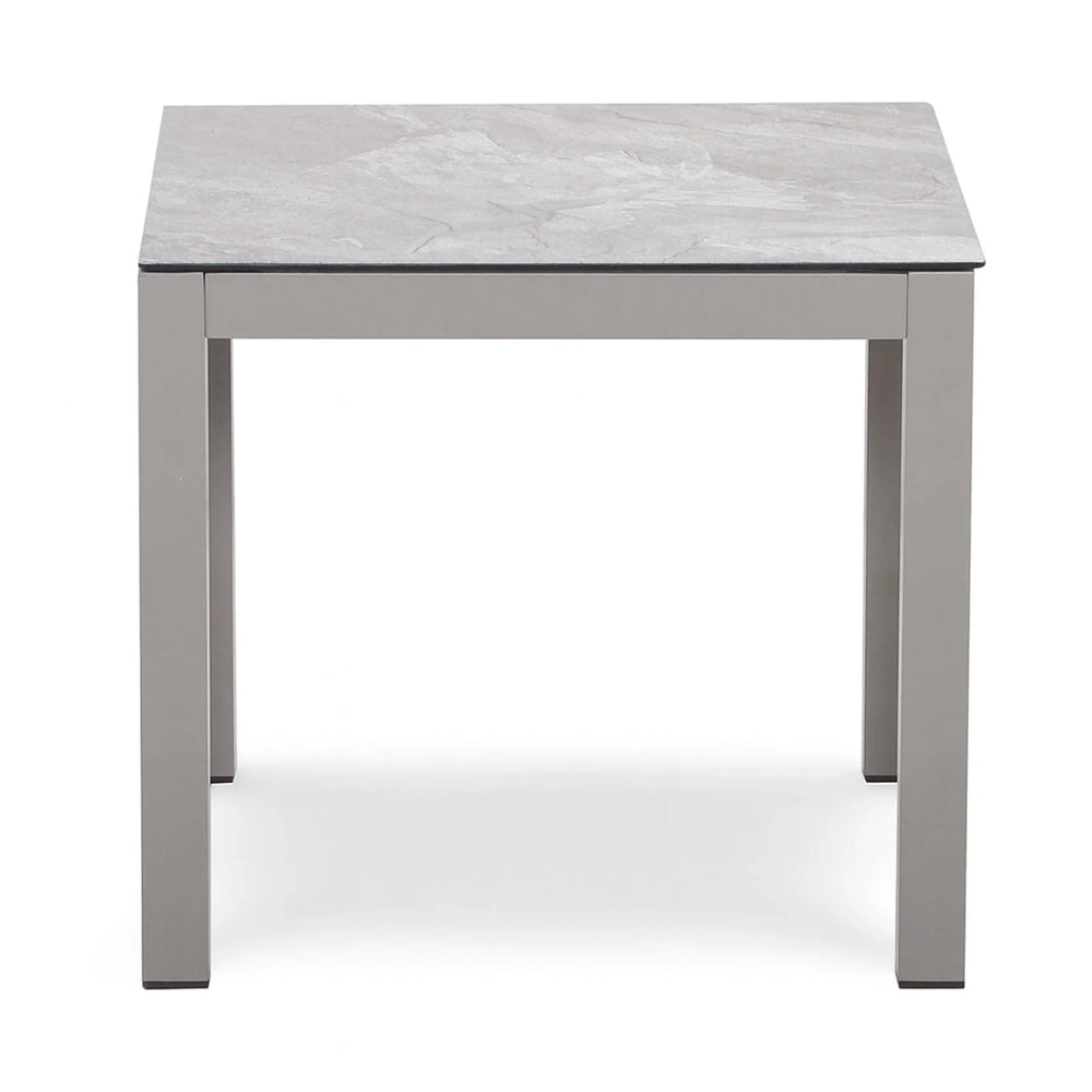 Square grey dining table with metal legs and marble effect tabletop, front view