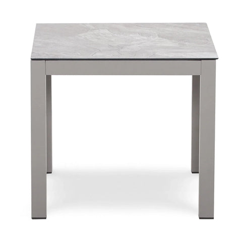 Square grey dining table with metal legs and marble effect tabletop, front view