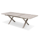 Rectangular dining table with light wood finish and crossed metal legs