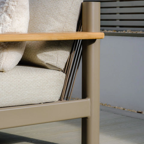 Beige outdoor sofa corner with metal frame, wooden armrest and cream fabric cushions