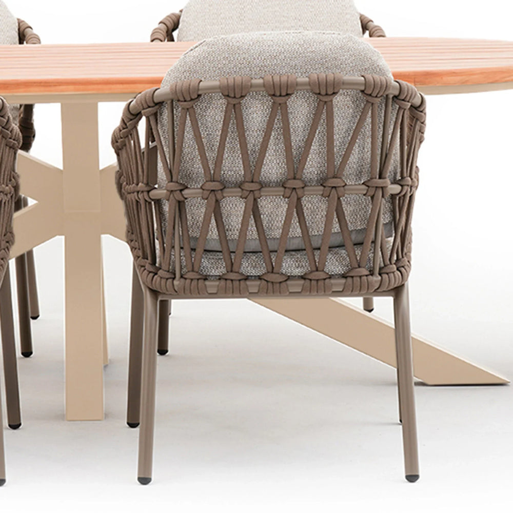 Rope woven dining chair with grey cushion and wooden table, rear angle view