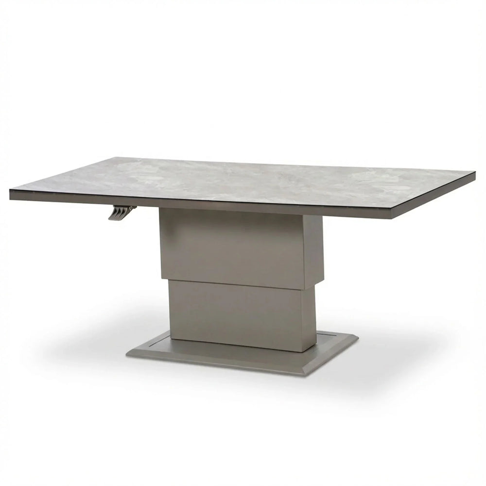 Rectangular grey ceramic dining table with pedestal base and extendable top