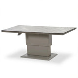 Rectangular grey ceramic dining table with pedestal base and extendable top