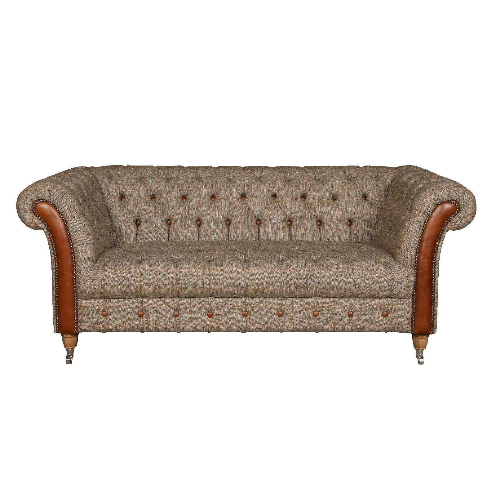 Chesterfield sofa with brown tweed upholstery, leather arms and button tufted detail