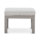 Grey fabric ottoman with cushion and sturdy square metal frame, front view