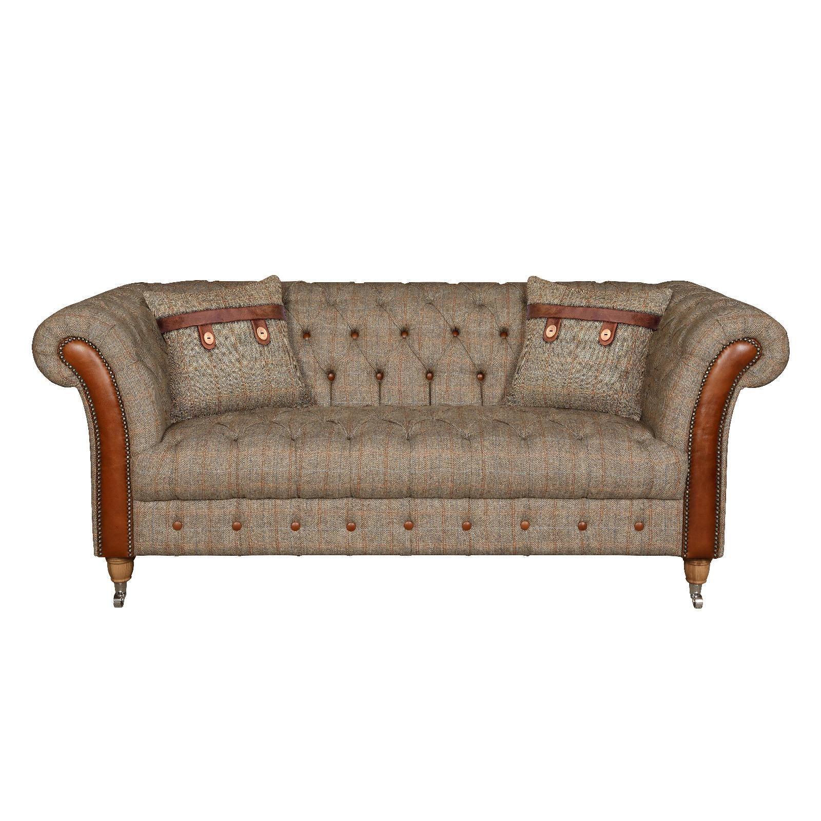 Brown tweed sofa with rolled arms, leather trim, button tufting and two matching cushions